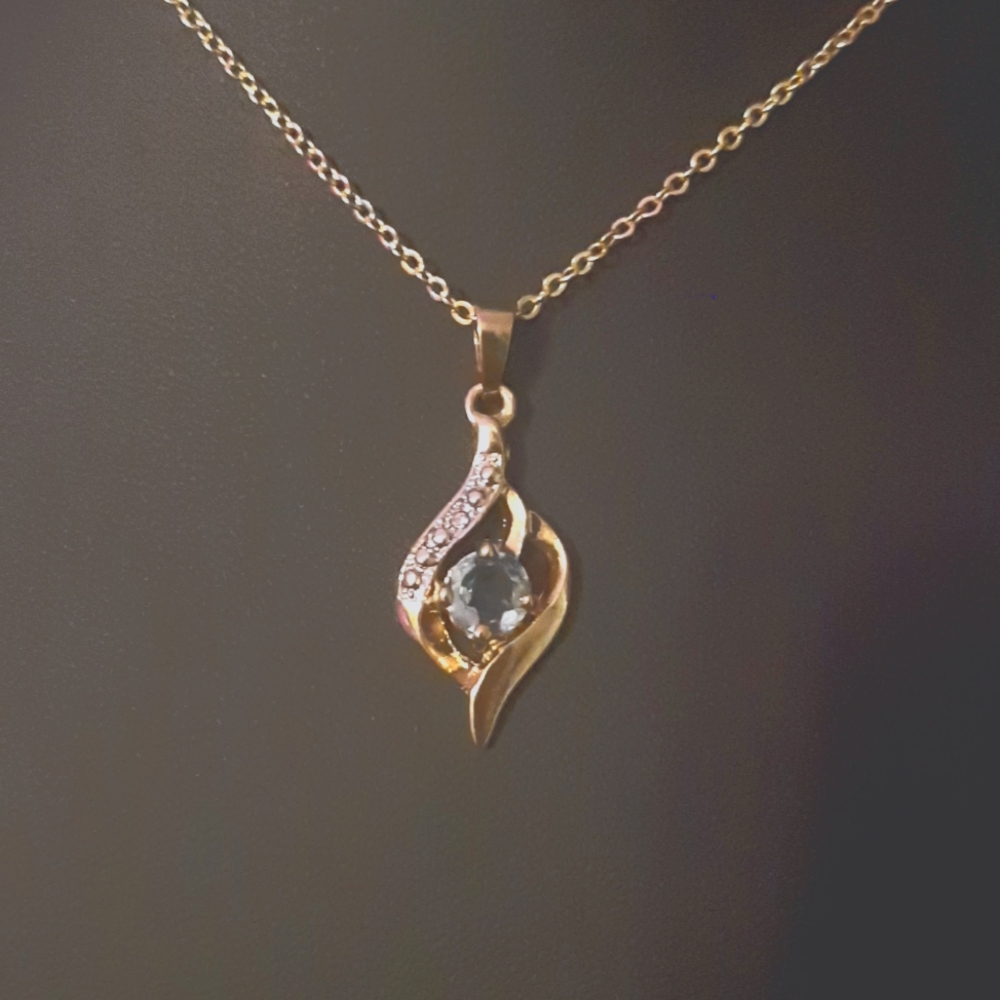 Light Blue Topaz, CZ, Gold W/ Ilver accents necklace